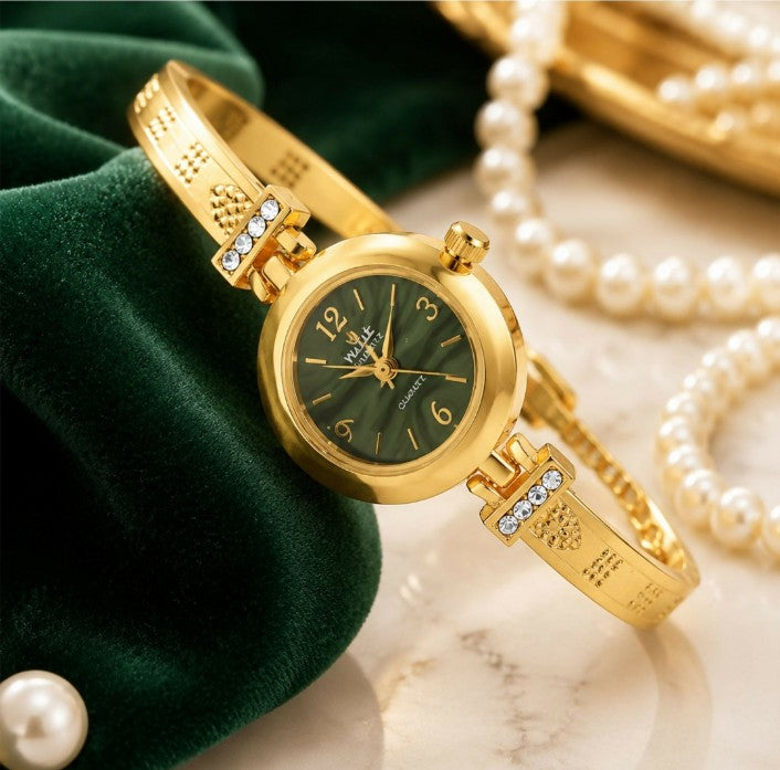 Upgrade your everyday style with the Golden Grace Crystal Bracelet Watch. Designed with a sleek gold-tone bracelet, sparkling crystal accents, and a classic black dial, this elegant watch combines fashion and functionality. Its adjustable chain closure en